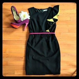 Black sheath dress with one-shoulder ruffle